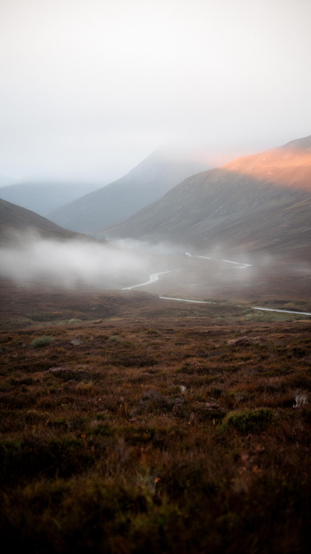 Misty Highland glen at dawn